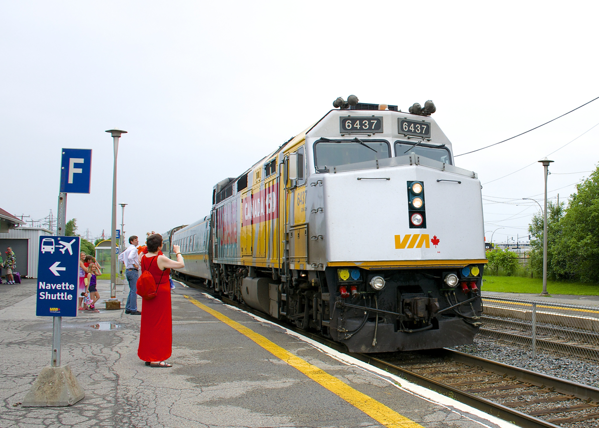 Happy Canada Day! One of only five VIA Rail F40's in a Canada 150 wrap (with one of them stranded in Churchill) brings VIA 624 into Dorval Station on an overcast Canada Day as my wife and daughter look on. Wrapped F40 VIA 6436 had arrived here just ten minutes before leading VIA 60.
