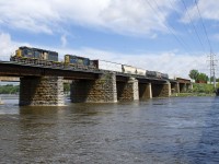 CN 327 is leaving the island of Montreal as it crosses the Ottawa River with a short train and a pair of EMD units for power. Lead unit CSXT 4067 is a rebuilt SD40-3 and was built as SD40-2 L&N 8110. Trailing is SD40-2 CSXT 8135, built as L&N 8135.