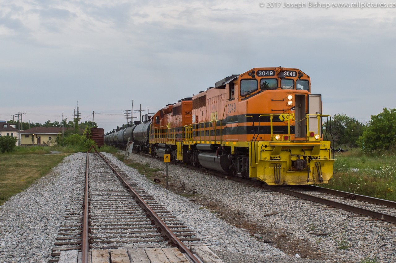 Taken almost one year ago, RLHH 3049 and RLHH 3404 lead SOR train 597 through Hagersville on a cloudy evening.  It doesn't seem like a year ago, looking back right now...but at this time last year early evening SOR trains were common enough to allow me to photograph them a handful of times between Garnet and Brantford.