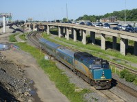 VIA 22 from Fallowfield is passing the clogged eastbound lanes of highway 20, filled with commuters heading towards downtown Montreal during the morning rush hour.