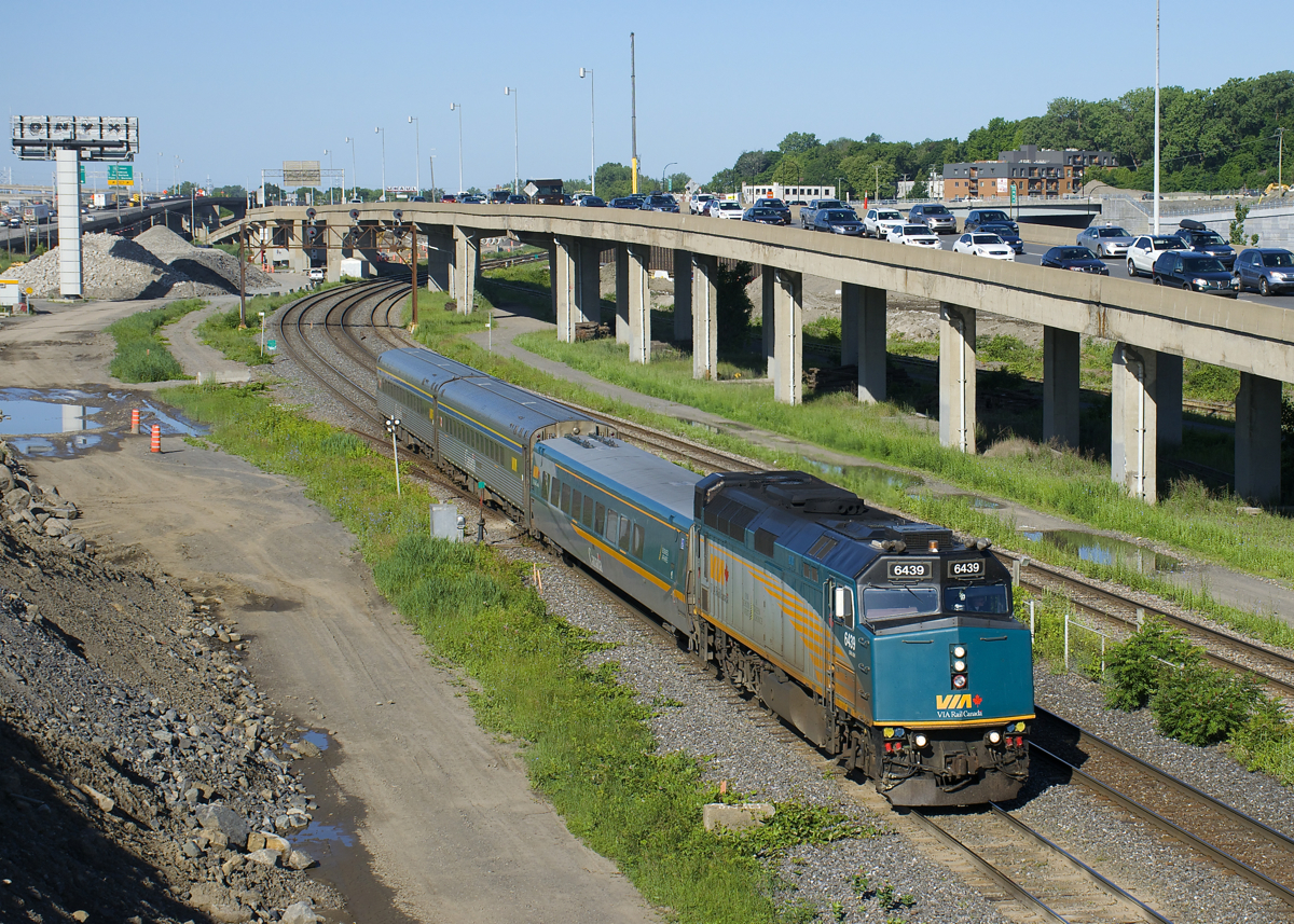 VIA 22 from Fallowfield is passing the clogged eastbound lanes of highway 20, filled with commuters heading towards downtown Montreal during the morning rush hour.