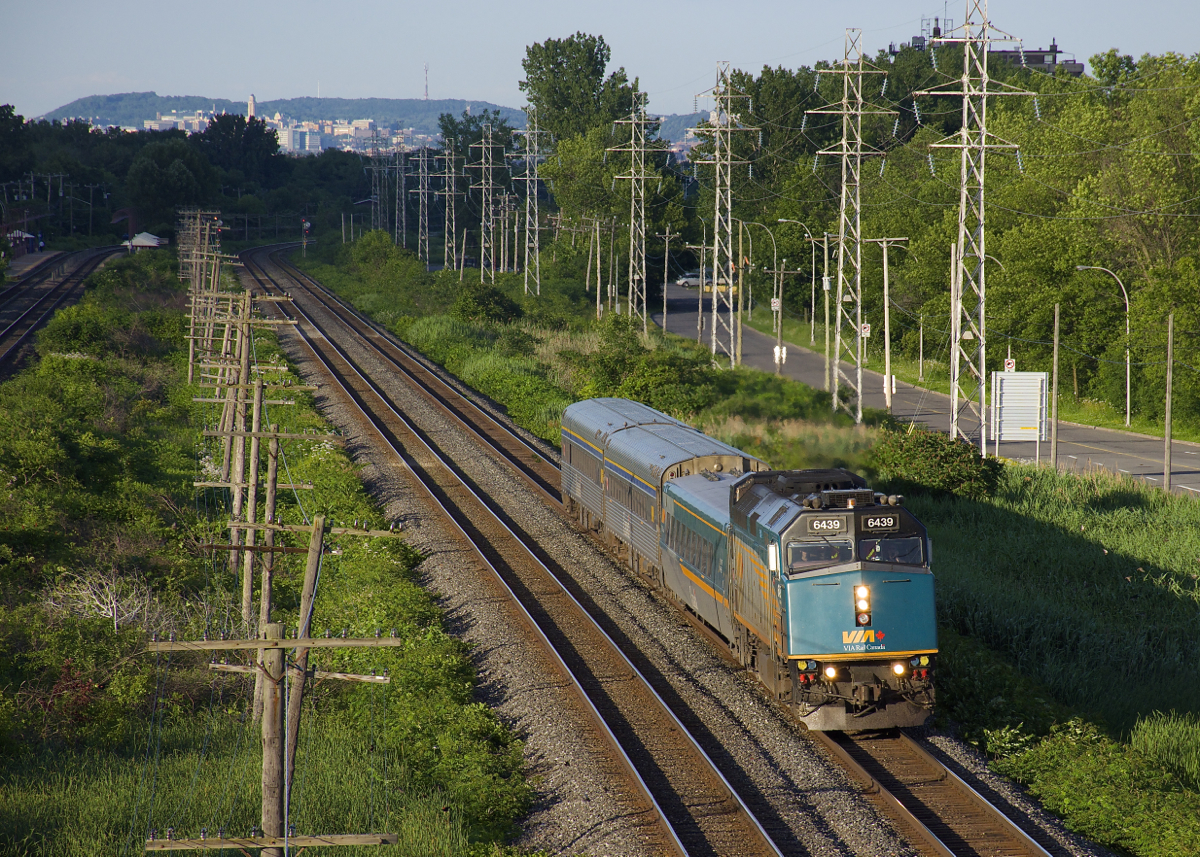 VIA 39 from Quebec City is westbound through Pointe-Claire with VIA 6439 leading a mixed consist.