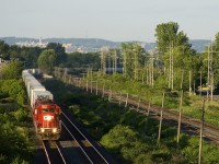 CP 133 has a pair of SD30C-ECO's (CP 5005 & CP 5048) as it heads west through Pointe-Claire. with Mount Royal in the background and CN's Kingston Sub at right.