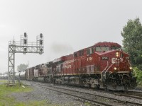 CP 650 has CP 7894 & CP 9754 for power with ethanol loads on their way to Albany, NY as it passes through Lasalle in the pouring rain.