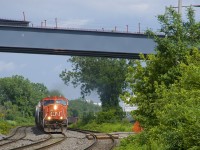CN X321 has CN 5621 & CN 2646 for power and overflow traffic from Southwark Yard in St-Lambert as it approaches the VIA Rail Dorval Station not too long after the sun came out after a quick downpour. Above is a new overpass over the CN and CP tracks here, not yet completed.