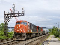 CN X321 has CN 5621 & CN 2646 for power and overflow traffic from Southwark Yard in St-Lambert as it approaches the VIA Rail Dorval Station not too long after the sun came out after a quick downpour. In the background is construction for what will be a new overpass over the CN and CP tracks here.
