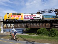 VIA 911 pushes VIA 26 for Quebec City over the Lachine canal and bike path.