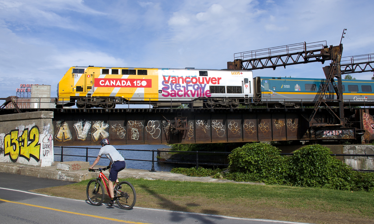 VIA 911 pushes VIA 26 for Quebec City over the Lachine canal and bike path.