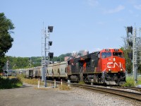 CN B730 is heading east through St-Henri as it splits a set of signals (not yet in use, though they've been in place over a year) near MP 3 of CN's Montreal Sub as VIA 65 splits an identical set of signals (in use for over two years) as it heads west. 