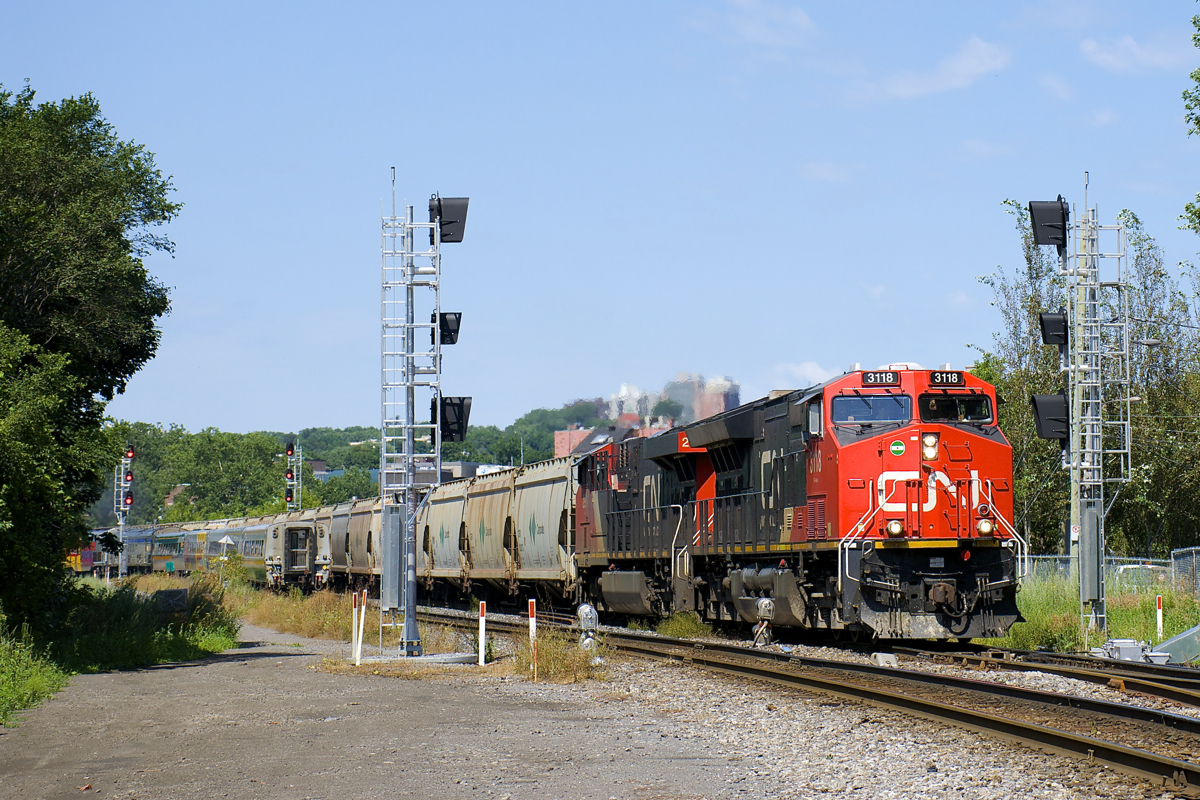 CN B730 is heading east through St-Henri as it splits a set of signals (not yet in use, though they've been in place over a year) near MP 3 of CN's Montreal Sub as VIA 65 splits an identical set of signals (in use for over two years) as it heads west.