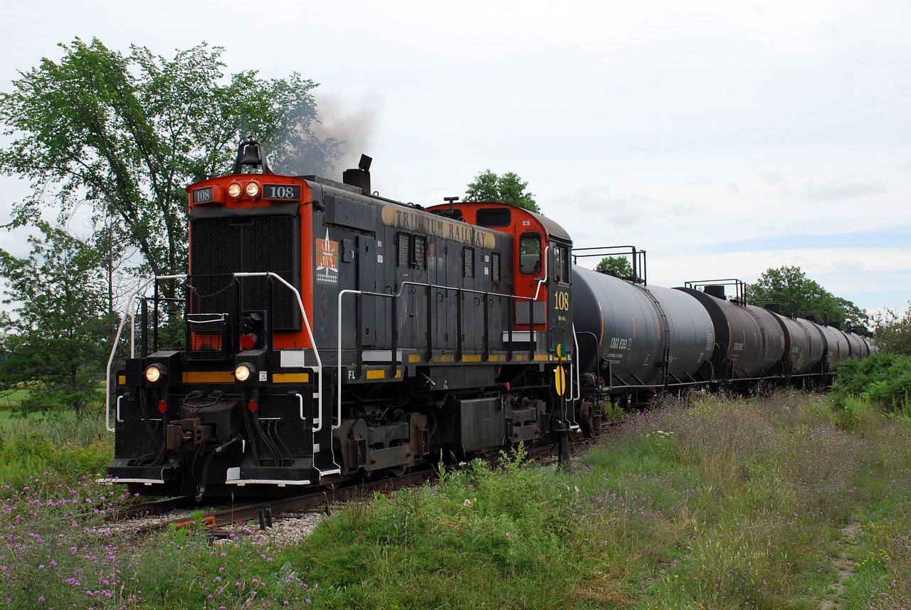 TRRY 108 has just finished switching in Dain City, and is shown passing WH Yard on the way to interchange with CP at Feeder Yard.