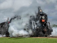 As a celebration of Canada's 150th anniversary as a nation, the Alberta Prairie Railway (APR) joined with the Alberta Railway Museum (AMR) in bringing their two steam locomotives together to run double-headed passenger trains between Stettler and Big Valley, Alberta for a week around Canada Day in 2017. The locomotives involved are the APR 2-8-0 #41 ex-Mississippi Railway, and ARM 4-6-0 #1392 ex-Canadian National. These photos show the activity on their many runs between these two centers. In this image #1392 leads #41 south out of Stettler.