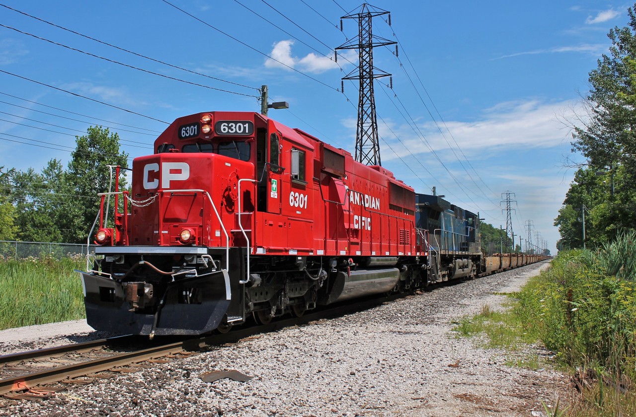 A freshly rebuilt SD60-3 leads CP 235 towards the States after doing their work in Walkerville Yard.