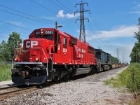 A freshly rebuilt SD60-3 leads CP 235 towards the States after doing their work in Walkerville Yard. 