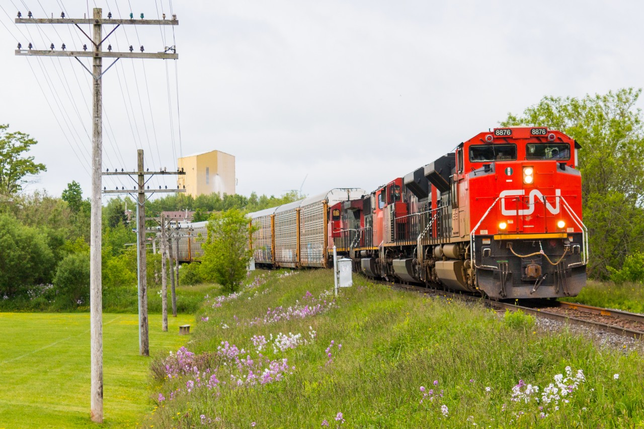 CN 8876 leads a train of auto racks through Truro heading west towards New Brunswick
