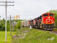 CN 8876 leads a train of auto racks through Truro heading west towards New Brunswick 