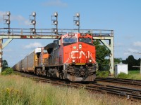 As I got to the tracks, ATCS displayed a clear block for a westbound. As I got to the tracks, I noticed CN E271 approaching with a touch of orange in trail!