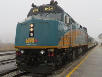 FOG SHROUDED F40. While waiting to board VIA # 72 to Toronto following a weekend of Original Six hockey in Detroit, this Newfoundland Railfan and his 3 travelling companions from the Rock were quite surprised to find the Windsor Station fully enshrouded in fog! Indicated by the twin beams of light from 6424 piercing the droplets, the four had mistakenly believed that they had left this type of weather back on the Island while they enjoyed the rail journey - a very pleasant part of each yearly hockey trip.   