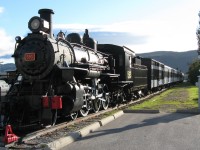 STEAM SURVIVOR. Former CNR 593, a Pacific Class 4-6-2, is the only surviving steam locomotive from the Newfoundland Railway and has found a safe home on static display at the Railway Society of Newfoundland's Historic Train Site in Corner Brook. Originally delivered as # 193 for the NR in 1921 by the Baldwin Locomotive Works for the sum of $36,870.00 as a passenger express engine, it remained as such until the arrival of the larger and more powerful Mikados started to arrive in the 1930's. After years of branchline duty pulling mixed trains, it ended it's career as a yard switcher in Port aux Basques with some 1.5 million miles of service behind her in 1957. Accompanying this beautifully restored engine and her tender on the narrow gauge mainline at the Humbermouth Station are Box Baggage 1598 (Eastern Car, 1954), Baggage-Express 1600 (CC&F, 1943), Coach 758 (CC&F, 1949), Diner 10 (CC&F 1943), and Sleeper 'Twillingate' (NSC, 1938). 