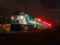 GO Transit's F59PH's have been around for nearly thirty years, but have only made it out to Niagara a few times, with one of the most recent occurrences having one unit put behind a "new" MP40 at the time as backup. This may very well be the first time a solo F59PH has come down to Niagara, and it did so just in time for the Canada Day weekend. Here, 557 powers the last Niagara weekend GO train of the day as it picks up passengers to go back to Toronto. GO Transit employees are known for often not being very receptive of railfans, especially at night, so it was a roll of the dice how this would pan out. Luckily, the dice rolled in my favour. Thanks especially to the crew for turning out the headlights and turning on the class lights. The shot turned out better than I expected.<br><br>I had other things to worry about out in the weeds though besides paranoid people as the cooler damp weather this summer has made it a paradise for ticks, and I managed to get bit. Up to 20% of black legged ticks carry Lyme Disease, so it was a scary reminder to stay out of the weeds or at least douse myself in bug spray. This wasn't my first encounter with one either, as I managed to have one latch to my sweater two years ago after falling into a ditch by CP's Welland Yard. Coincidentally, it was over the current hot topic of a SOO SD60.<br><br>As for GO 557 however, it came back the next weekend as well. With GO having recently returned to running 6 car trainsets on some trains again, the remaining F59PH's have made appearances on many, and perhaps can live out plenty more runs in Niagara before their legacy on GO Transit ultimately comes to an end in a few years. GO Transit does have 16 new AC powered MP40's on order, and if testing goes well, it is expected all will be delivered by 2018 and replace the remaining F59PH's shortly afterwards. With that in mind, get your shots, as a couple of years will be gone before you know it. After that, the Toronto Railway Museum will likely be the only place you can find an F59PH still in GO colours.