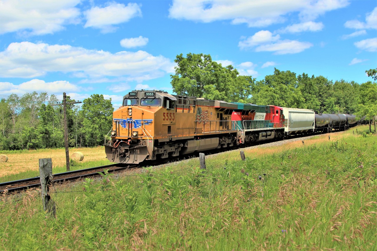 Todays CP 147 is lead by UP 5553 with Ferromex 4672 as it travels west around the bend approaching the Victoria Road crossing with its manifest of cars picked up at Guelph Junction.
