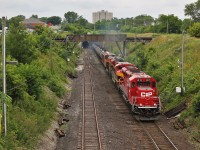  CP 650 with a colourfull consist comes screaming out of the Detroit River tunnel in Windsor, ON.