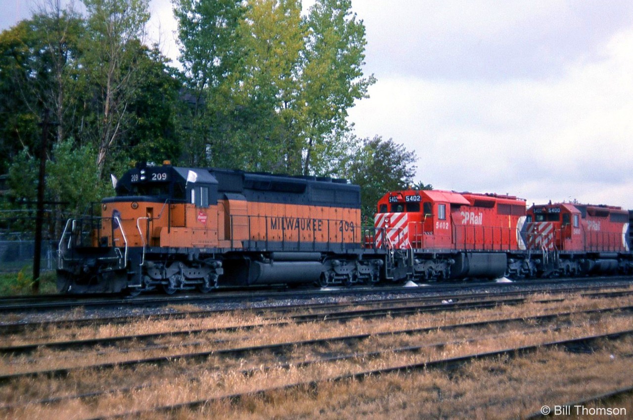 Three SD40's head up this westbound freight, all facing forward "elephant style": Milwaukee Road SD40-2 209 (soon to be patched and renumbered for owner SOO Line as their 6370), and CP 5402 & 5400, both ex-Quebec, North Shore and Labrador 200-series SD40's that CP had acquired a group of (note the extended fuel tanks and snow shields behind the cab on 5402).