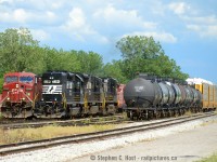 And a second photo from June 25 25th when I had the luck to capture a meet between NS C93 and CP 255 on the CN Stamford Subdivision (Whew). Fort Erie's neat because although the track is owned by CN, the majority of trains aren't CN (and this has been the case for a very long time!). From what I can tell, CP runs 6 per day, CN 4 per day, and NS two (counting both directions). Contrast this to what happens just across the border and it's any wonder people spend any time in Fort Erie. I had no time to cross (just one hour to get any trains) and my timing was impeccable.





