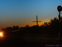 Frogs and crickets sing into the still and cool summer evening air, signalling the coming of darkness; the horizon glows orange with a midsummer's sun playing hide and seek until morning. It's 9:41 PM and a lone sentinel glows red to indicate the pending passage of a train on the CPR. In moments the frogs and crickets go silent as a rumble of EMD motive power grows closer, and a K3 horn blows in the distance. Codeline glows orange from headlights and my anticipation grows. EMD locomotives throb ever louder as T69's hogger pours it on to get to track speed, 60 mph, and your heart begins to beat faster. This stretch of track between the curves at Killean and Puslinch may as well be a racetrack, the stories from decades past, of trains making up time are the things of legend. Modern electronics and GPS forbid overspeed trains today, but the show never disappoints. To come will be part two of this small story.