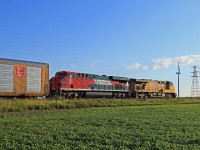 UP 5553, with helper FXE 4672, is in charge of U.S. bound train 147 at mile 88.1 on the CP's Windsor Sub.