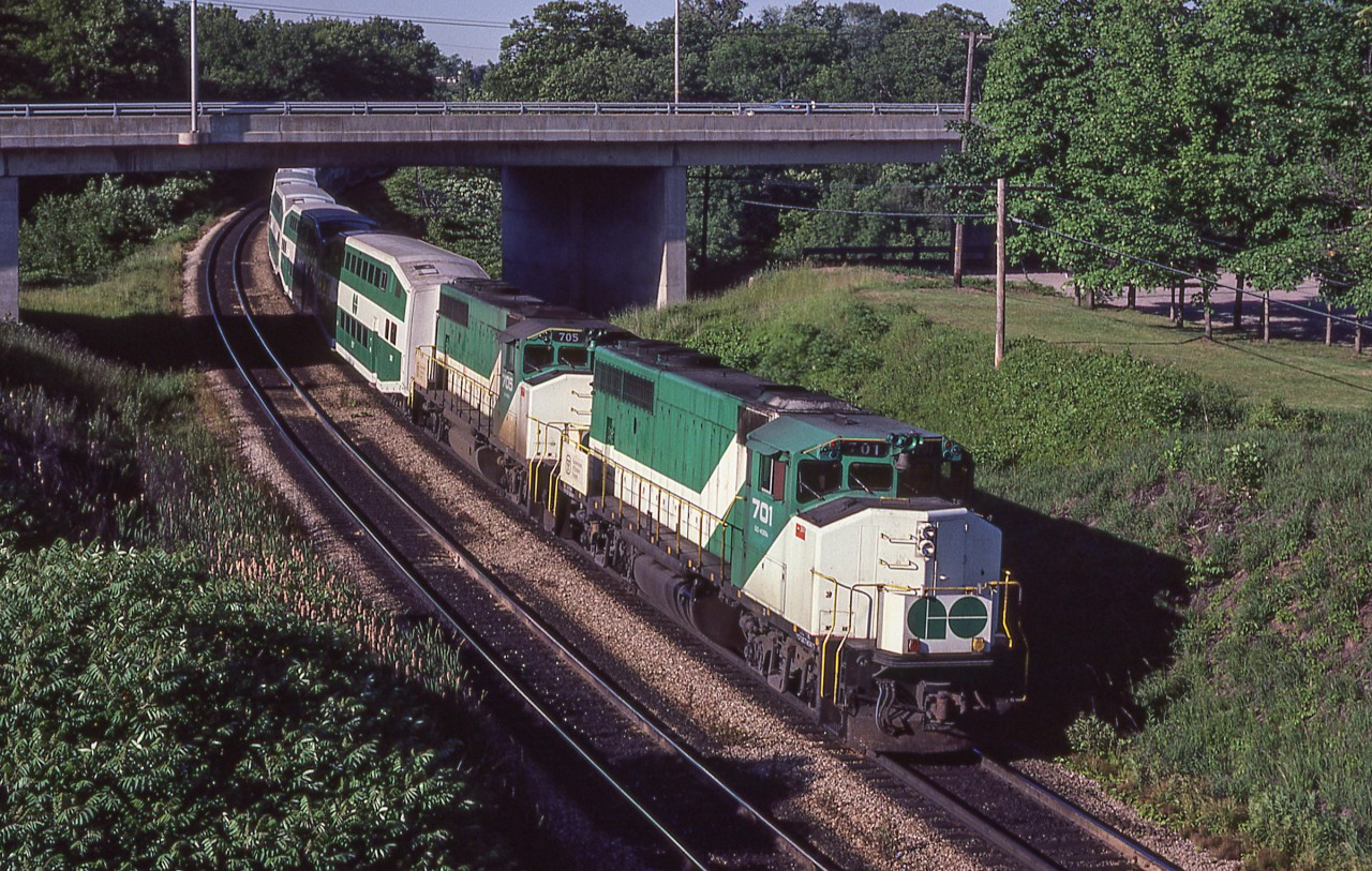 GO 701 leads a Hamilton-bound train under the Plains Road West bridge.
