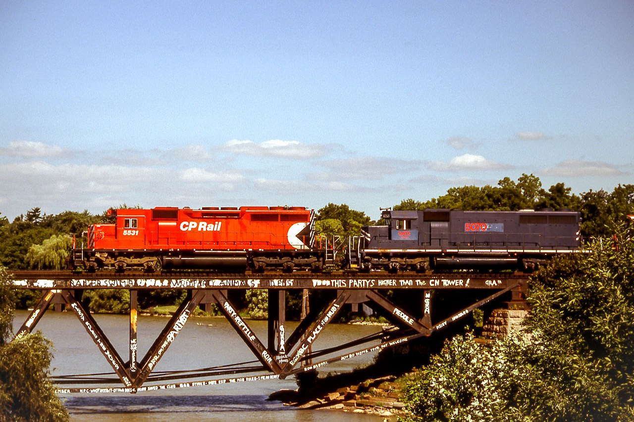 CP 5531 is heading a westbound train across the Credit River. The second unit is leased GATX 5070.