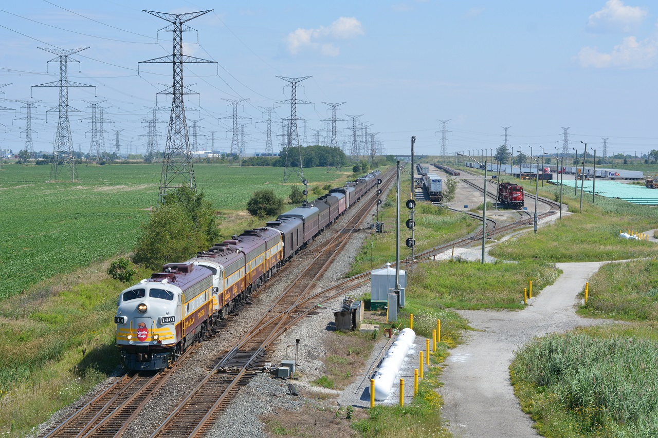 After departing Mactier just before 8am and a crew change in Lampton yard, 40B continues West on the CP Galt Sub past the Toronto Expressway Terminal at Hornby East