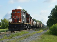 Prepping its train for another trip south to Blenheim, CN 514 gets to work early shunting around a few cars on the local siding track.