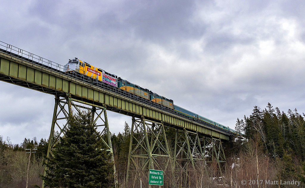 Back in February 2017, on it's maiden Atlantic Canada voyage with the Canada 150 wrap, VIA 15 is seen crossing over the trestle at East Mines, Nova Scotia of a cloudy February afternoon.