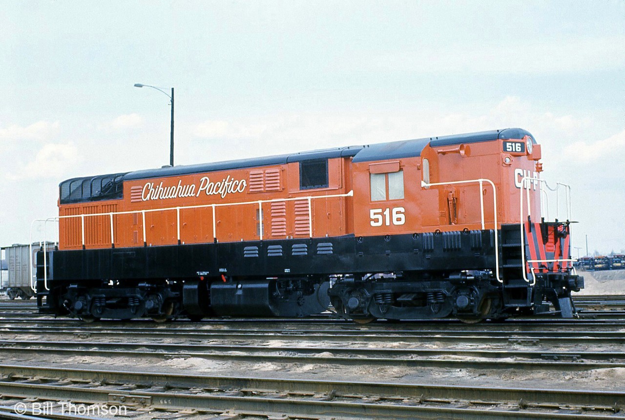 Chihuahua Pacifico FM H16-44 516 sits at CN's MacMillan (Toronto) Yard in fresh paint in April 1974, likely on its way back to Mexico. 516 was part of a group of H16-44's CHP had rebuilt by United Railway Supply in Carterville, Quebec in the early 70's. Some units were high hood, others CHP had already given oddball chop-nose jobs.
