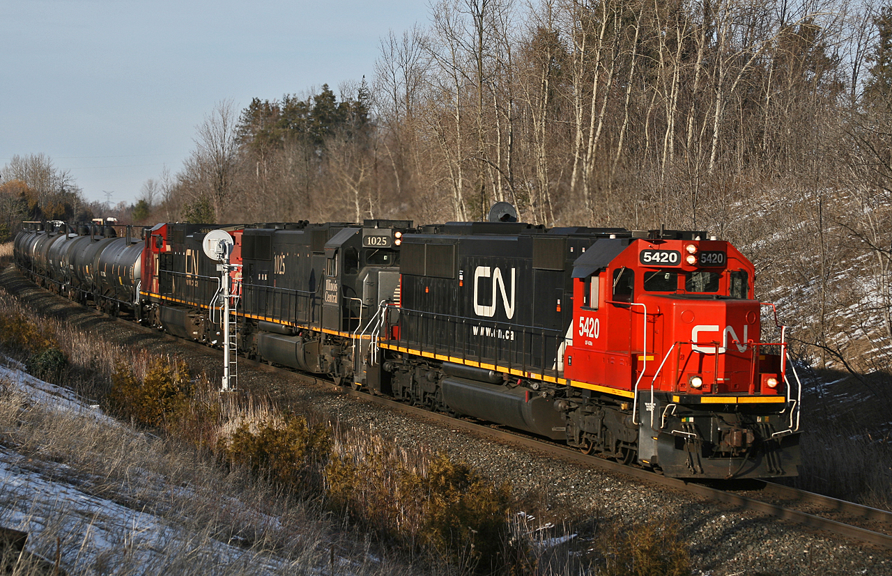 CN 435 rolls by the approach signal to Mansewood on a lovely February afternoon with CN 5420, IC 1025 and CN 2154 providing the horsepower on this 124 car train.