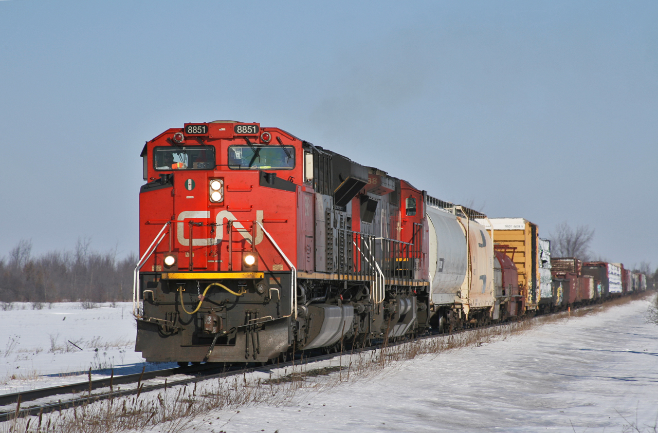 After meeting A 45131 17 at Brechin East, 302 works hard to get their train back up to track speed as they pass through the farmland just south of Brechin.

CN M 30241 16: CN 8851, CN 2188 - 86 cars