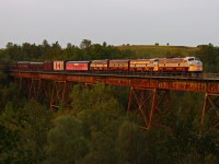 CP 41B-28 rolls through Cherrywood. Nice to finally be able to knock this one off the bucket list.<br>Cherrywood was a popular location for everyone chasing this move, as it is typically the last shot of the day. There had to be close to 20 foamers on the embankment; both local and from all over. In addition to that, another 4-5 at the grade crossing and flying drones.<br>What most don't know (and I forgot to mention to those there) is that this shot will not be available much longer, as the City of Pickering plans to extend 3rd Concession to a new subdivision on the northeast side of the valley. The result being a new roadway that will span the valley directly north of the bridge (essentially between where I'm standing and where the tracks are).<br>So, be thankful for what you have, and take advantage of it while you can! I was very happy to have shot this one in my all-time favourite location along the Belleville Subdivision. I'm sure everyone there will appreciate their shots in a few years, once this is no more.