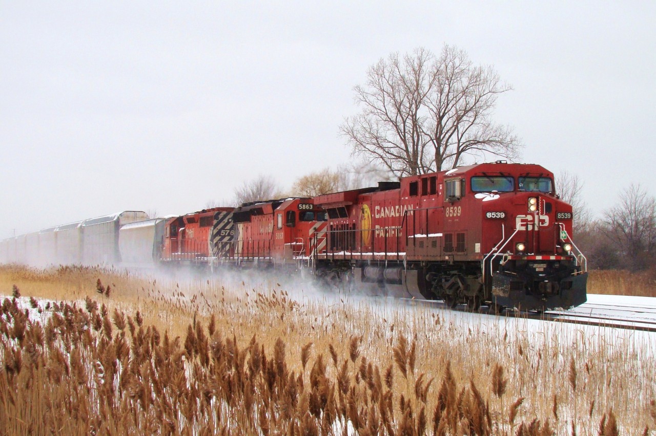 CP train 422 kicks up snow as it is seen leaving Windsor bound for Toronto behind CP 8539, large multimark SD40-2 5863 and CP 5767. The next day couple of days 5863 would lead this train out of Windsor.