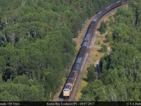 Looking down on the CP Canada 150 train as it traces along the north shore of lake superior from Kama Bay Lookout.