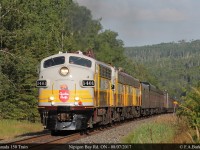 The CP Nipigon sub parallels the Trans Canada Highway in many places, including the intersection with Nipigon Bay Road. The CP Canada 150 train approaches on a rare section of straight track.