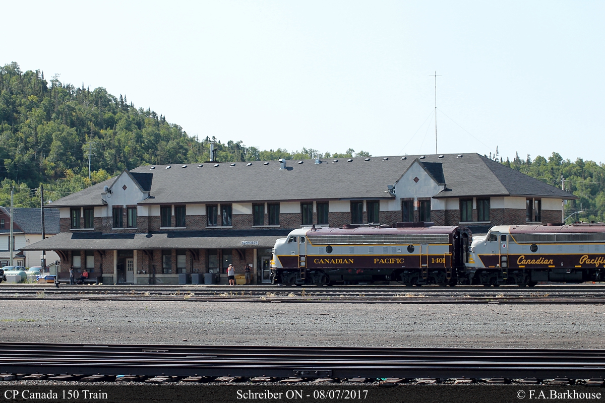 The Schreiber station, built in the 1920's, makes a fitting backdrop for the Tuscan and Grey F-Units and passenger cars as the CP Canada 150 train pauses for a crew change.