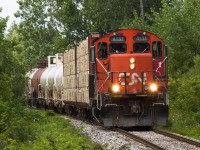 CN 4131 leads a 7 car train towards Cainsville at Johnson Road.  The first two bulk head cars are for the Rembos Lumber Yard.  The trailing five tank cars are destined for Blastech where they are being refurbished.