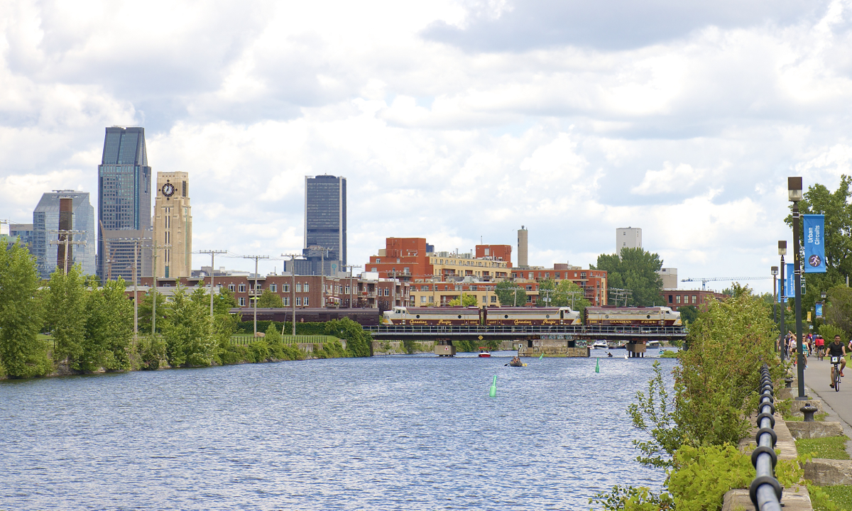 The CP Canada 150 train is seen crossing the Lachine Canal with Montreal's skyline behind it after it surprisingly took CN's Montreal Sub and Wharf Spur to get to the Port of Montreal for its show. Power is CP 1401, CP 4107 & CP 4106, with B-unit CP 1900 left behind at St-Luc Yard, apparently to get washed.