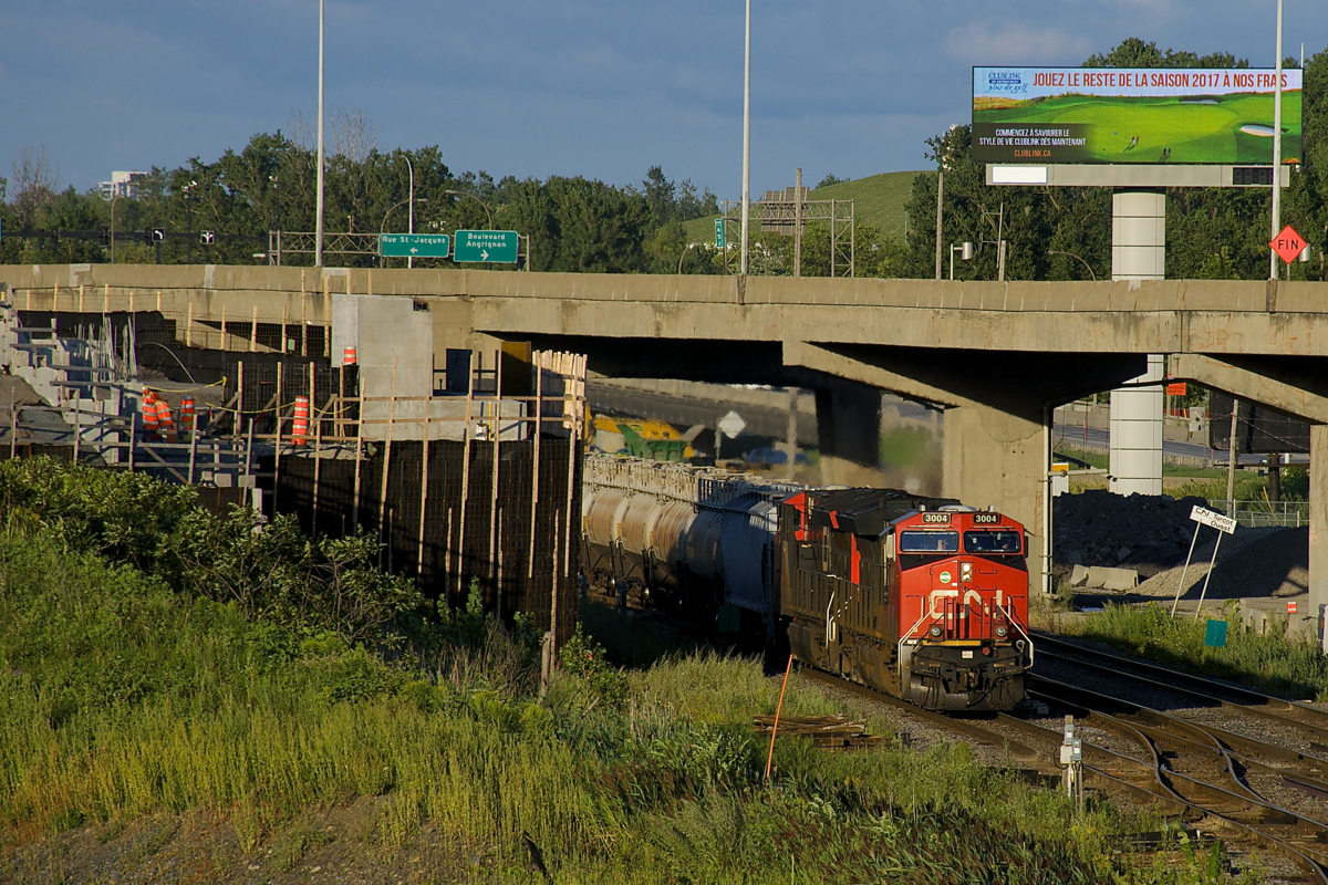 CN 309 with a pair of ET44AC's (CN 3004 & CN 3034) bypasses a crew change at Turcot West as it heads towards Taschereau Yard where it will set off the headend TankTrain cars (usually CN 309 bypasses the yard).
