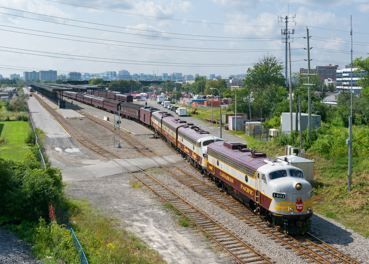 After setting off two string of cars on two tracks, F-units CP 1401, CP 4107, CP 1900 & CP 4106 are leaving Ottawa Station with nine cars just before the CP 150 show begins. That part of the train will lay over at nearby Walkley Yard until the show ends, presumably there was not enough room for the whole train to stay at the station the entire afternoon.