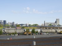 AMTK 68 (694 while on CN tracks) has just left Montreal's Central Station and is passing the Pointe St-Charles Yard on the elevated portion of CN's St-Hyacinthe Sub. Soon it will take the Victoria Bridge and leave the island of Montreal.