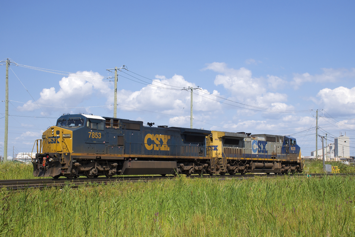 A pair of older GE's (CSXT 7853 & CSX 9031) await the call of duty on a sunny afternoon in Beauharnois.