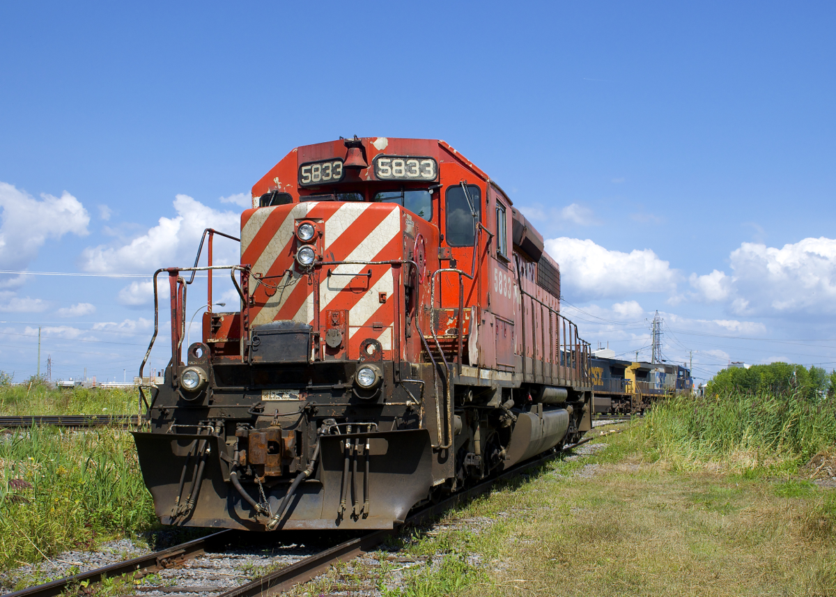 From what I've been told, CP 5833 is to be scrapped where it sits, on a siding off the CSXT Montreal Sub in Beauharnois. Built for CP in 1974, it will not be around much longer. Behind is a pair of CSXT road units.